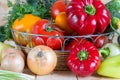 Close up fresh harvested vegetables in wicker basket on wooden table. Natural homegrown products. Royalty Free Stock Photo