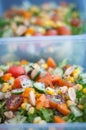 Close up of fresh and healthy salad made with fruits and vegetables in a container. Royalty Free Stock Photo