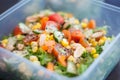 Close up of fresh and healthy salad made with fruits and vegetables in a container. Royalty Free Stock Photo