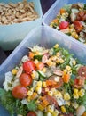 Close up of fresh and healthy salad made with fruits and vegetables in a container. Royalty Free Stock Photo