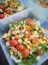 Close up of fresh and healthy salad made with fruits and vegetables in a container. Royalty Free Stock Photo