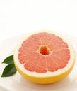Close up of fresh juicy grapefruit cut in half on plate, created using generative ai technology Royalty Free Stock Photo