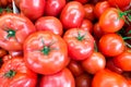 Close up of fresh, juicy, ripe tomatoes pile. lycopene and antioxidant in fruit nutrition good for health and skin. flat lay.