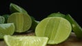 Close-up of fresh lime rests upon a rustic wooden cutting board. Comestible.