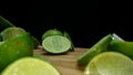 Close-up of fresh lime rests upon a rustic wooden cutting board. Comestible.