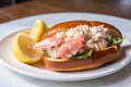 Close-up of a Fresh Lobster Roll with Creamy Mayo, Chunks of Lobster Meat, and a Squeeze of Lemon Royalty Free Stock Photo