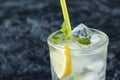 Close up fresh Mojito cocktail with lemon, mint and ice in jar glass on black background. Summer cold drink and cocktail Royalty Free Stock Photo