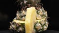 Close up of fresh pineapple with slice of peel pineapple insert. Comestible.