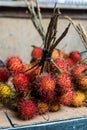 Close-up of Fresh rambutan fruit sold at the market in daylight