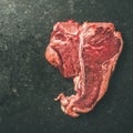 Close-up of fresh raw beef meat porterhouse steak, copy space Royalty Free Stock Photo