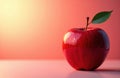 A ripe red apple with a green leaf on a soft pink background Royalty Free Stock Photo