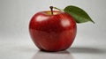 Close-Up of a Fresh Red Apple with a Single Leaf on Smooth Grey Surface Royalty Free Stock Photo