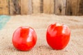 Close up Fresh red tomato on grunged sack background