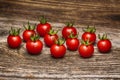 Close-up of fresh, ripe cherry tomatoes on wood. Royalty Free Stock Photo