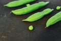 Close up of fresh ripe green peas on black background. Healthy organic food Royalty Free Stock Photo