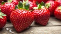 Close-up of fresh, ripe strawberries on a rustic wooden surface Royalty Free Stock Photo