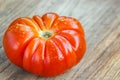 Close-up of fresh, ripe tomato on wooden background Royalty Free Stock Photo
