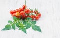 Close-up of fresh, ripe tomatoes on wood background Royalty Free Stock Photo