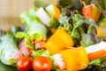 Close up of fresh salad of lettuce, cucumber and tomato on plate for healthy eating...Fresh vegetable salad in Black plate on