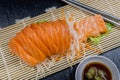Close up fresh salmon sashimi set salad on bamboo plate, Japanese food. Royalty Free Stock Photo