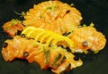 Close-up of Salmon slices with lemon slices.