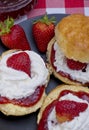 Close up of fresh scones and strawberry jam Royalty Free Stock Photo