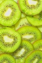 Close-up fresh slices of juicy kiwi fruit on white background. Slices of kiwi fruit in sparkling water on white Royalty Free Stock Photo