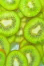 Close-up fresh slices of juicy kiwi fruit on white background. Slices of kiwi fruit in sparkling water on white Royalty Free Stock Photo