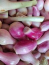 Close-up of fresh small red onions on natural background Royalty Free Stock Photo