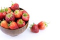 Close up fresh strawberries fruits in a wooden bowl isolated on white background. fruit and healthy concept Royalty Free Stock Photo