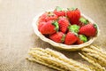 Close up fresh strawberry on basket and sackcloth background Royalty Free Stock Photo