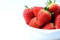 Close up fresh strawberry in white bowl isolated white background with copy space Royalty Free Stock Photo