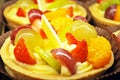 Close up of fresh and tasty cakes with fruits and berries Royalty Free Stock Photo