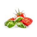 Close-up fresh tomato with basil isolated on fhite background Royalty Free Stock Photo