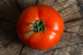Close-up of fresh Tomato on a wood background Royalty Free Stock Photo