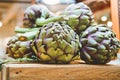 Close up of fresh vegetable artichokes in italian farmer market. Royalty Free Stock Photo