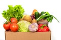 Close-up Fresh vegetables in a cardboard box on a white background. Fresh and healthy food delivery concept Royalty Free Stock Photo