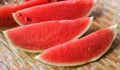 Close up fresh watermelon pieces tropical summer fruit - watermelon slice on wood background Royalty Free Stock Photo