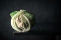 Close-up of a fresh white and green cauliflower isolated on dark background. copy space for text Royalty Free Stock Photo