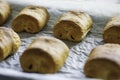 Close up freshly baked chocolate croissants on tray. Traditional french pastry Royalty Free Stock Photo