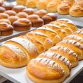 Close-up freshly baked pastry goods on display in bakery shop. Selective focus