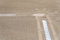 Close up of freshly chalked baseline leading to home plate, dirt only, empty baseball field on a sunny day Royalty Free Stock Photo