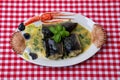 Close-up of freshly cooked pieces of European eel fish served on a porcelain plate with a creamy dill sauce and potatoes standing Royalty Free Stock Photo