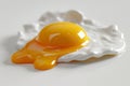Close-up of a freshly cooked sunny-side up egg with a slightly runny edge on a bright white backdrop. Generative AI Royalty Free Stock Photo
