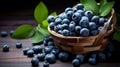 close-up freshly picked blueberries and blueberry leaves in a basket on a wooden table,