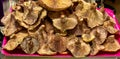 A close-up of freshly picked mushrooms over a fuxia plate