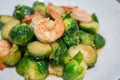 Close up, Fried Brussels Sprouts or Brassica oleracea  with fresh shrimp on plate Royalty Free Stock Photo