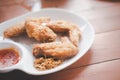 Close up fried chicken wings served with sweet sauce Royalty Free Stock Photo