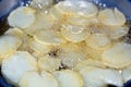 Close-up of fried chips potatoes frying in boiling hot oil in a deep fryer at home. fast fries, Junk food concept Royalty Free Stock Photo