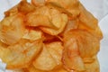 A close up of fried chips potatoes served in a plate covered with kitchen towels. fast fries, Junk food concept, home made Royalty Free Stock Photo